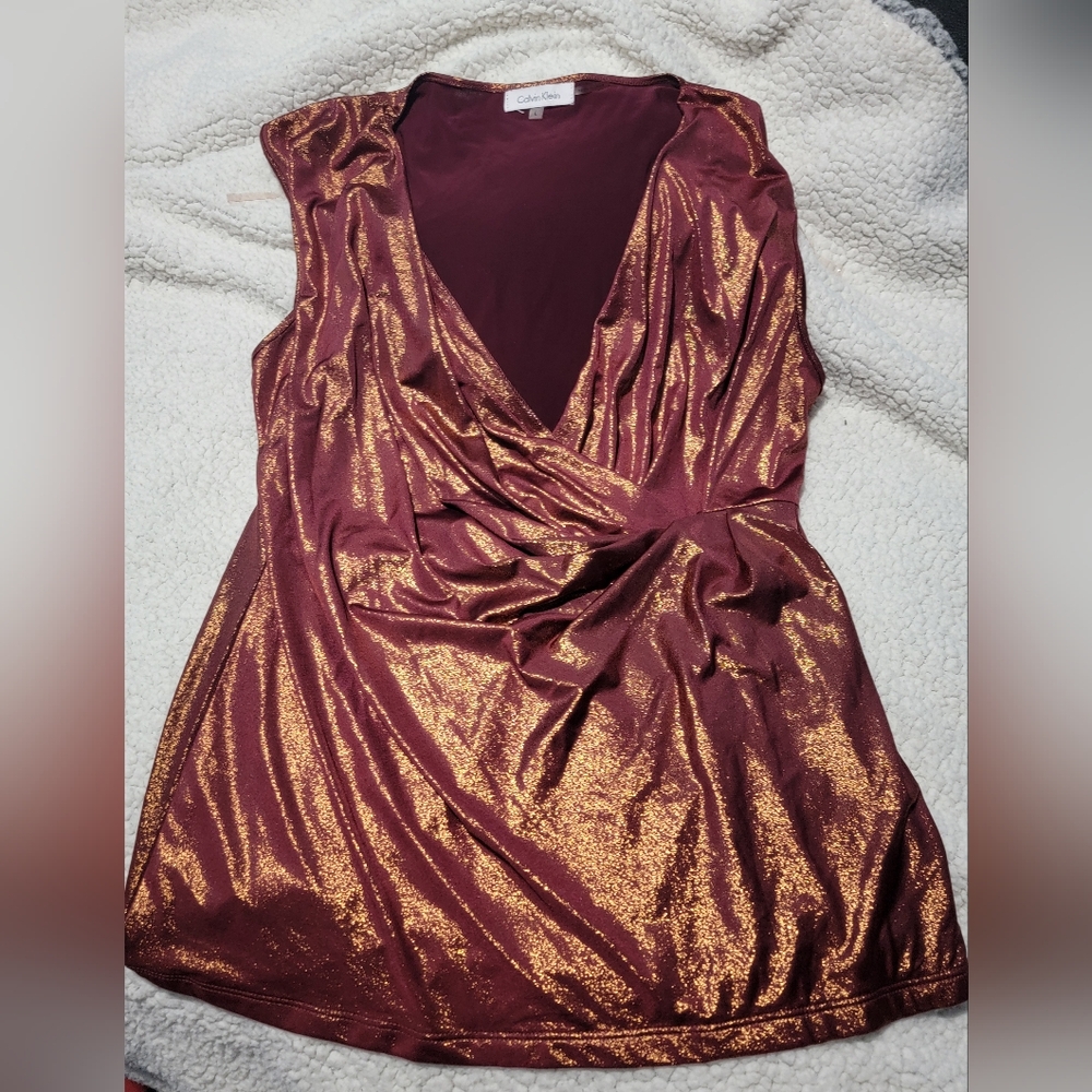 Calvin klein shimmery copper top. Low neck line, Size L. Never worn, like new